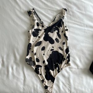 Alterd state cow print bodysuit